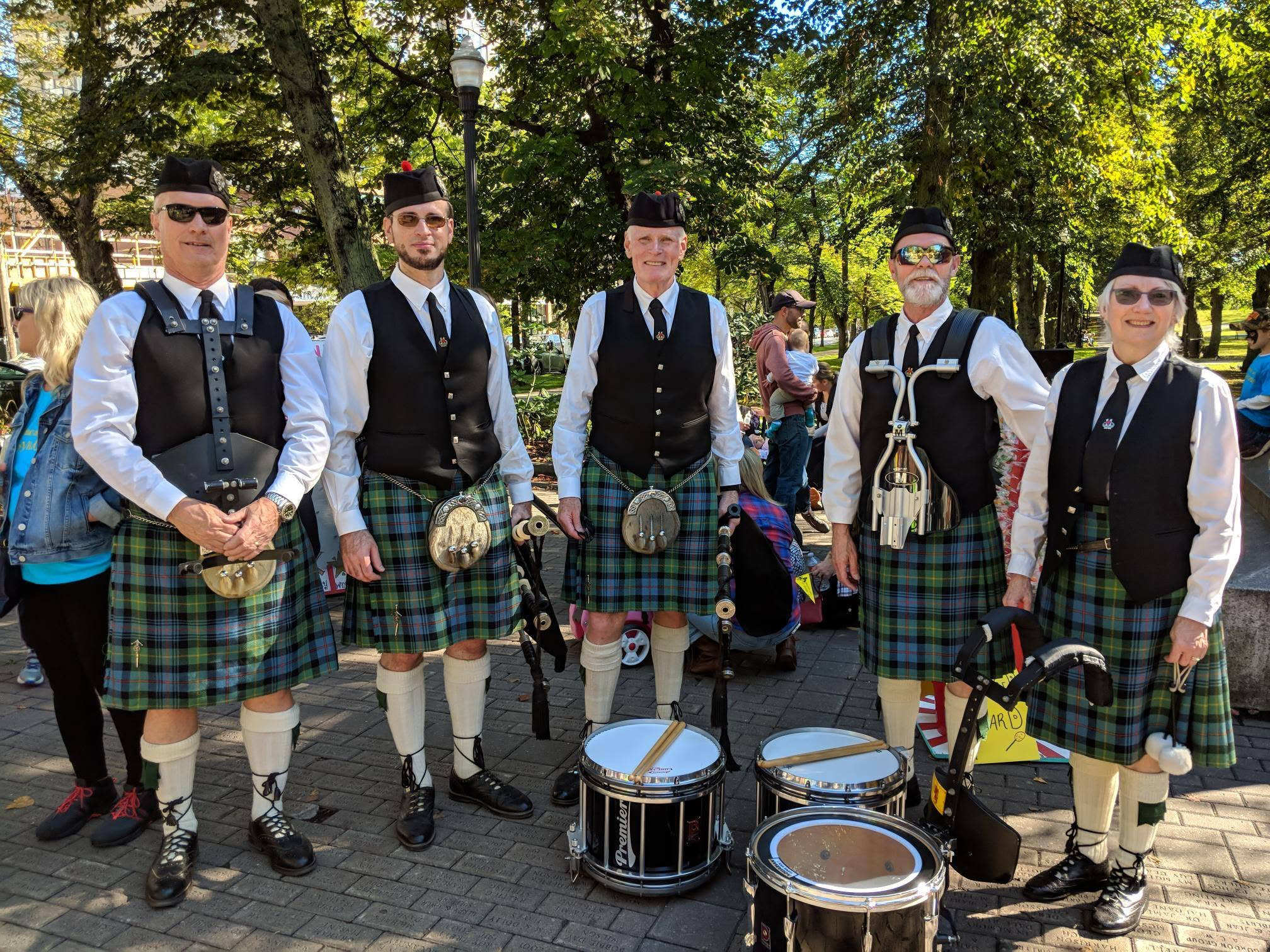 Members of The Pipes and Drums of Clan Farquharson with their instruments