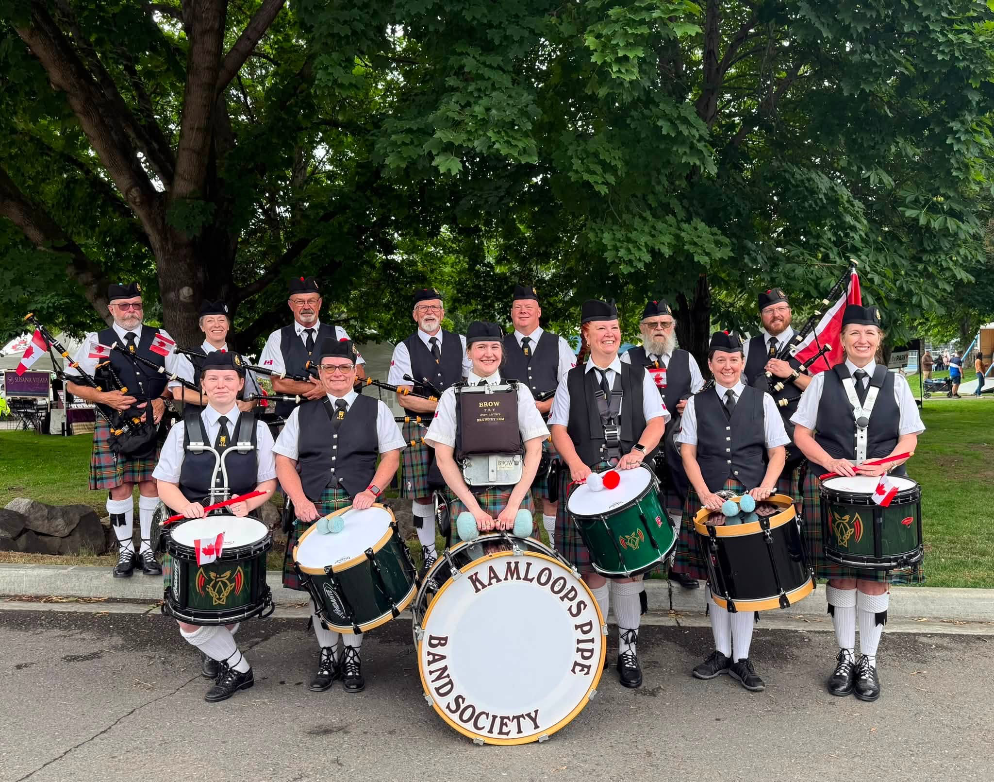 Kamloops Pipe Band Society members posing with their instruments