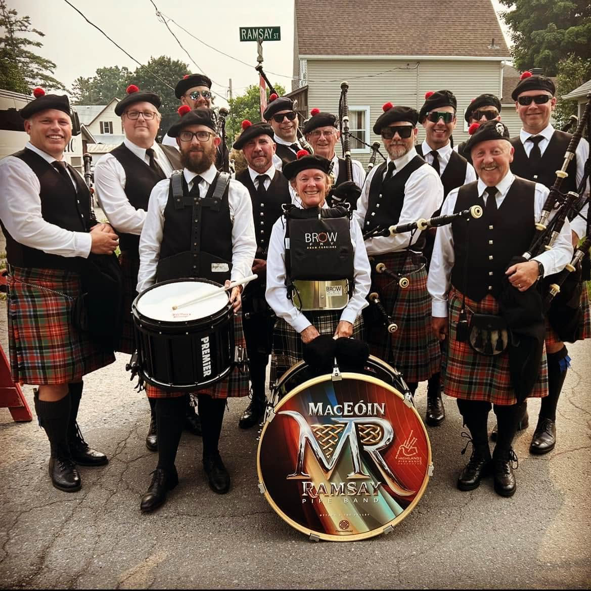 MacEóin-Ramsay Pipe Band members gathered with their pipes and drums