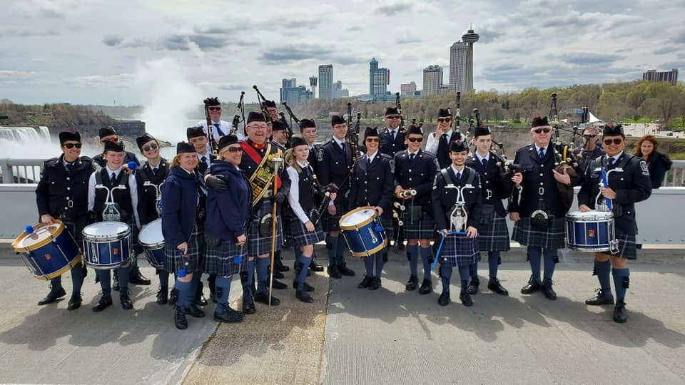 Niagara Regional Police Pipe Band gathered beside Niagara Falls