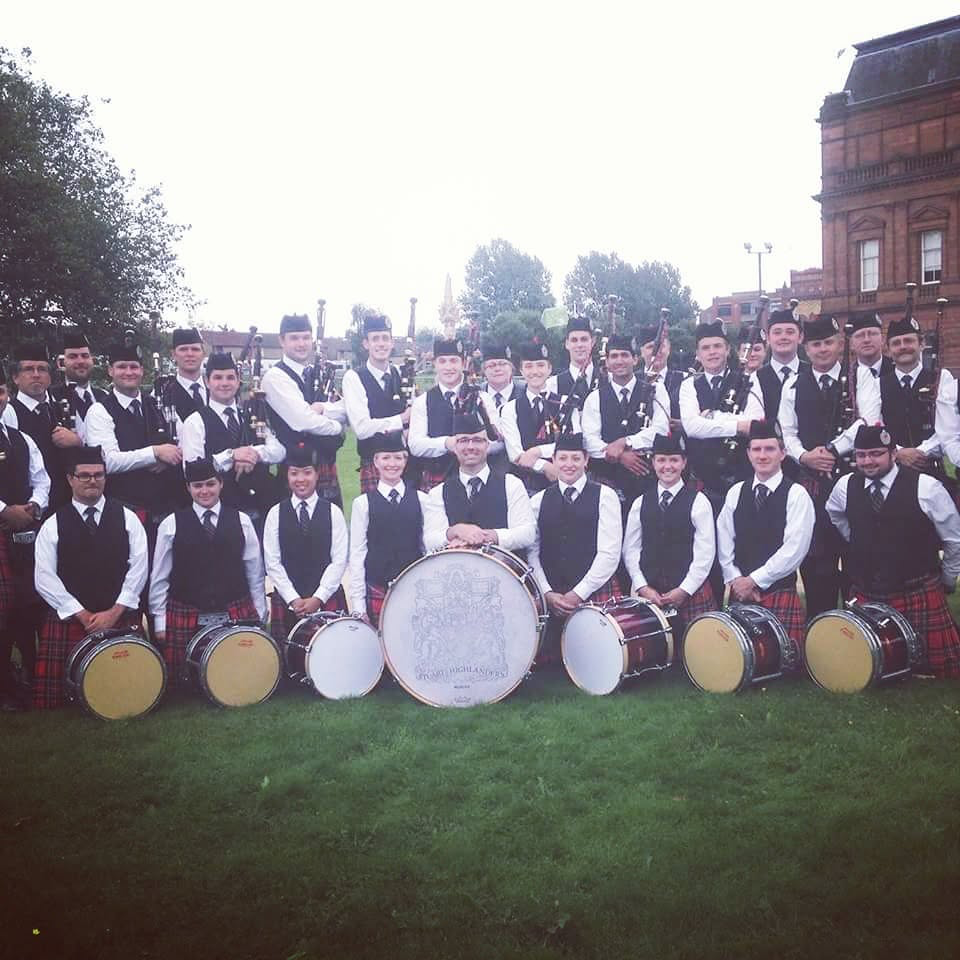 Stuart Highlanders Pipe Band gathered with its pipes and drums